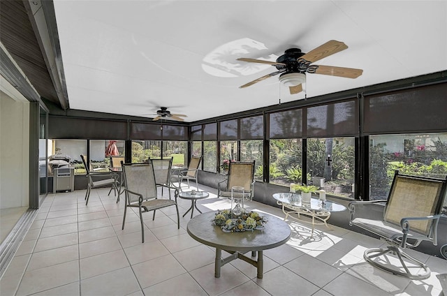 sunroom / solarium with ceiling fan and a healthy amount of sunlight