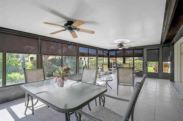 sunroom / solarium with a wealth of natural light and ceiling fan