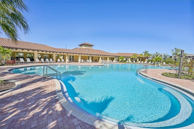 view of swimming pool featuring a patio