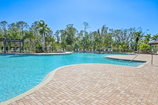 view of swimming pool featuring a pergola