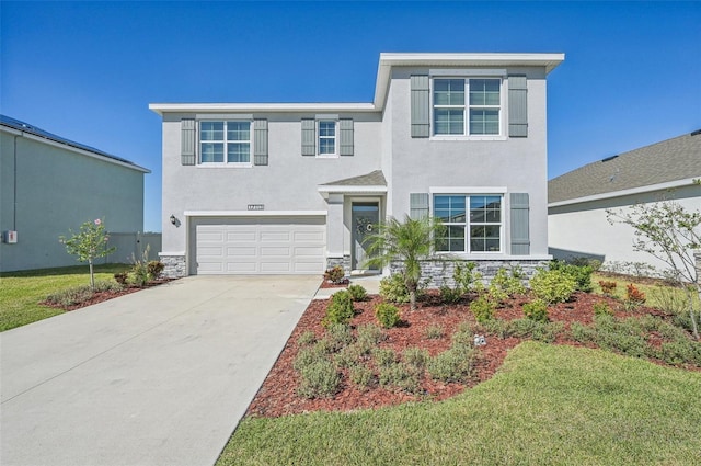 view of front of house with a front yard and a garage