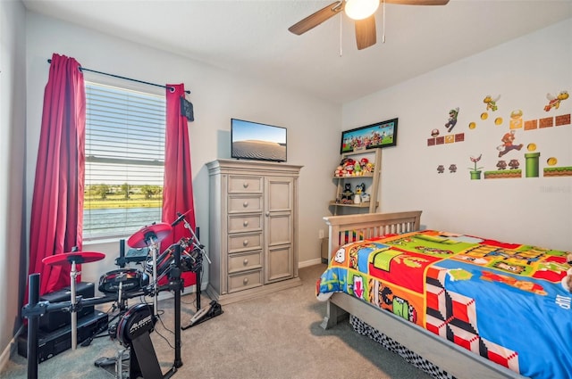 carpeted bedroom with ceiling fan