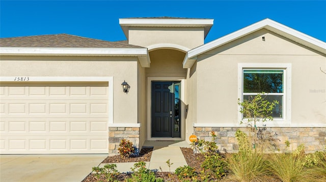 view of exterior entry featuring a garage