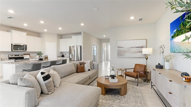 15813 6th Ave E, Bradenton, FL 34212 - living room with light tile patterned flooring and recessed lighting