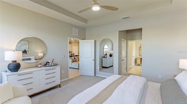 bedroom featuring light carpet and ceiling fan