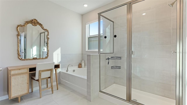 bathroom with tile patterned floors and independent shower and bath