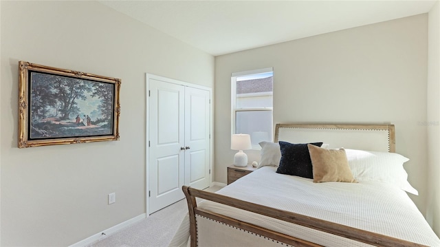 carpeted bedroom featuring a closet