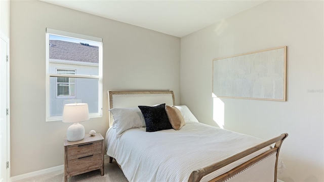 bedroom with light colored carpet