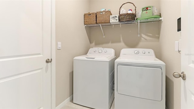 laundry area with independent washer and dryer