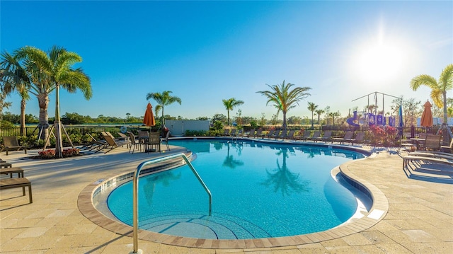 view of swimming pool with a patio area