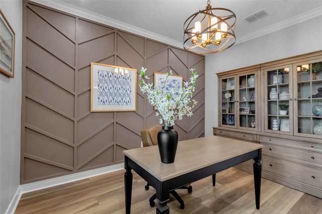 office space featuring light hardwood / wood-style floors, a chandelier, and ornamental molding