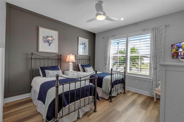 bedroom featuring ceiling fan and hardwood / wood-style floors