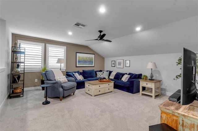 carpeted living room with vaulted ceiling and ceiling fan