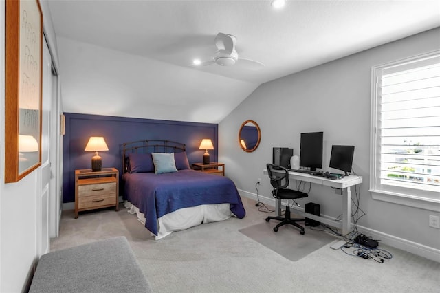 carpeted bedroom with ceiling fan and lofted ceiling