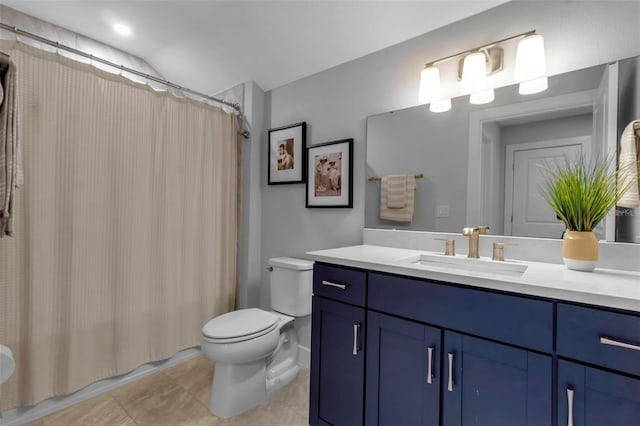 bathroom with toilet, tile patterned floors, and vanity