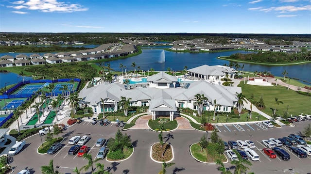 birds eye view of property with a water view