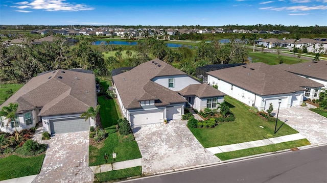 birds eye view of property with a water view