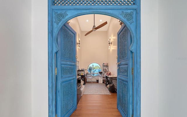 681 Casey Key Rd, Nokomis, FL 34275 - corridor featuring wood finished floors and arched walkways