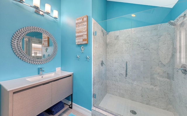 bathroom featuring vanity and a shower with shower door