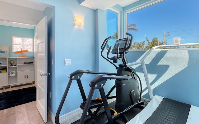 exercise area with light wood-type flooring