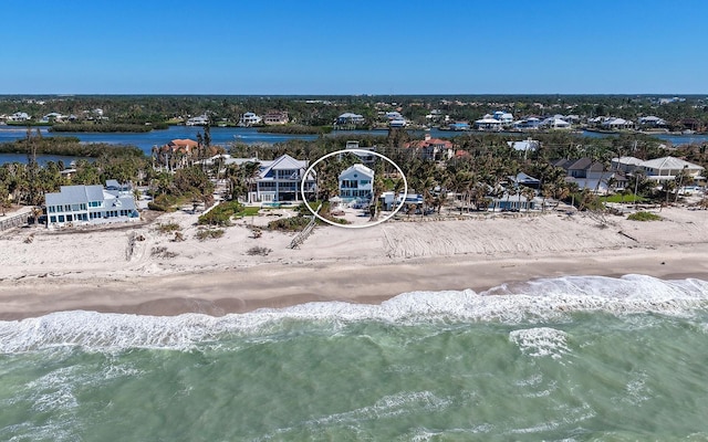 aerial view featuring a water view and a view of the beach