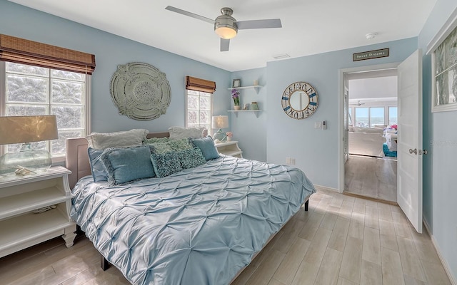 681 Casey Key Rd, Nokomis, FL 34275 - bedroom with wood finished floors and a ceiling fan