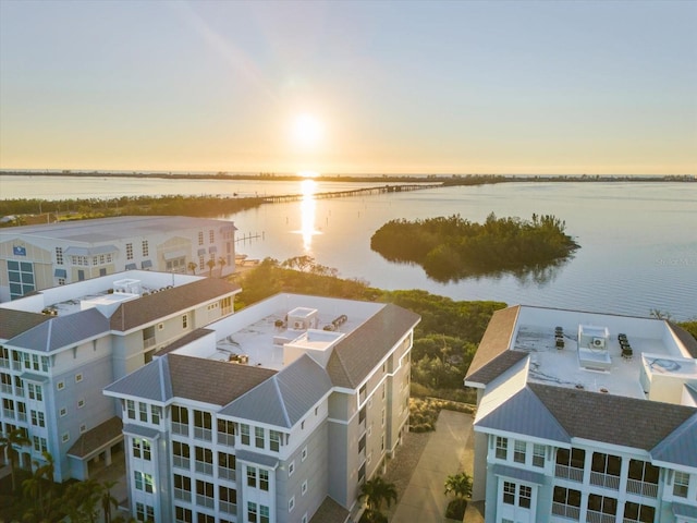 aerial view at dusk with a water view