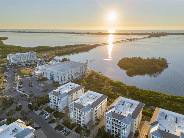 aerial view at dusk with a water view