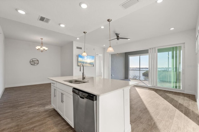 kitchen featuring white cabinetry, sink, dark wood-type flooring, stainless steel dishwasher, and a kitchen island with sink