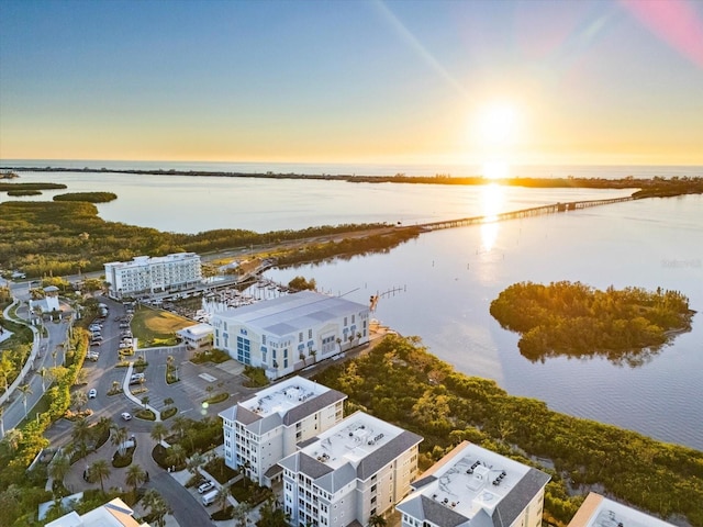 aerial view at dusk with a water view