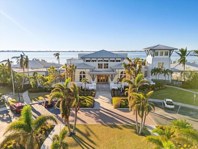 exterior space featuring a yard and a water view