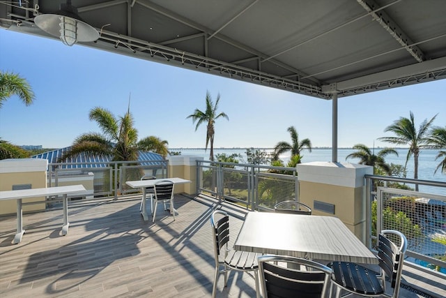 wooden terrace with a water view