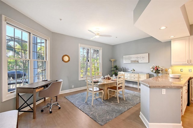 dining space featuring ceiling fan, plenty of natural light, and light wood-type flooring