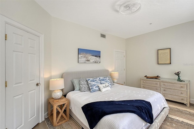 bedroom with wood-type flooring