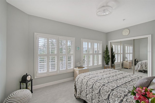 carpeted bedroom with a closet