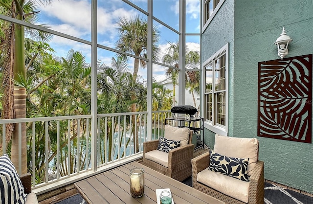 sunroom / solarium with a water view