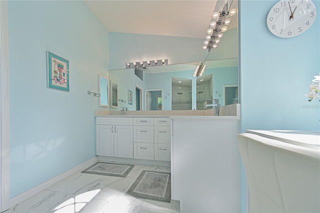 bathroom featuring an enclosed shower and vanity