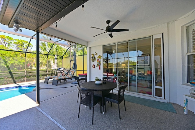 sunroom / solarium featuring ceiling fan and a wealth of natural light