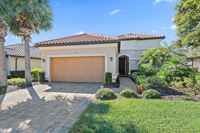 mediterranean / spanish house featuring a garage