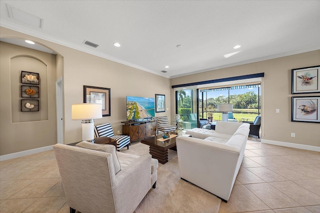 living room featuring ornamental molding and light tile patterned flooring