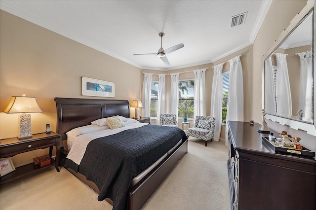 bedroom with light carpet, ceiling fan, and ornamental molding