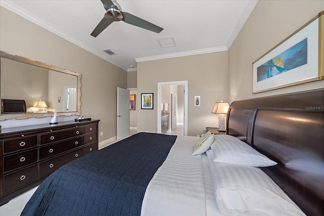 carpeted bedroom featuring ceiling fan, crown molding, and ensuite bath