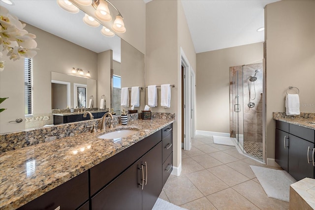 bathroom with vanity, tile patterned floors, and an enclosed shower