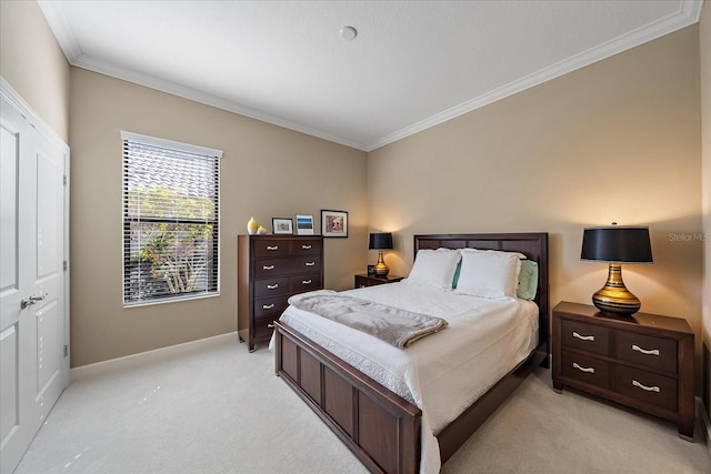 bedroom featuring light colored carpet, ornamental molding, and a closet