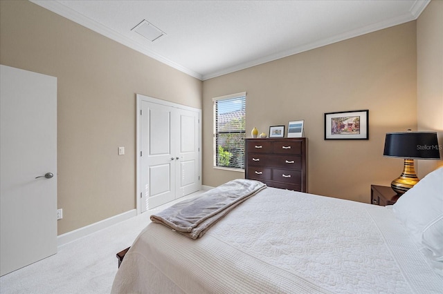 bedroom with light colored carpet, crown molding, and a closet