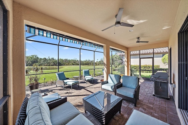 sunroom / solarium with ceiling fan