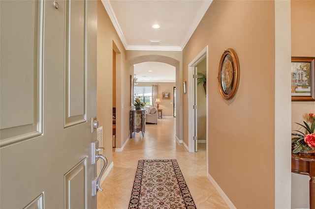 hallway featuring light tile patterned floors and ornamental molding