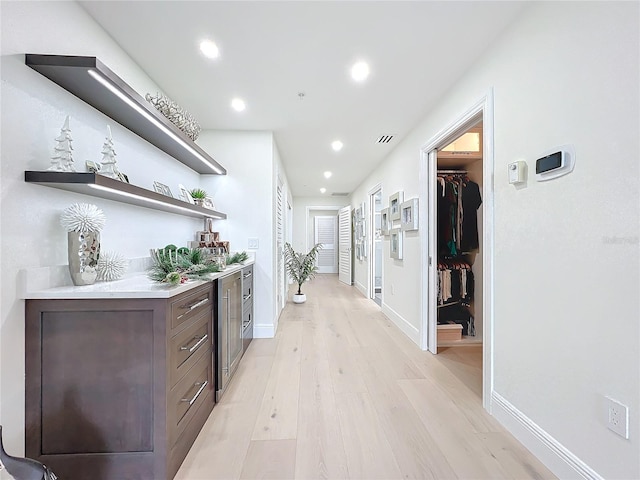 hall with light wood-type flooring