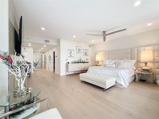 bedroom with light hardwood / wood-style flooring and ceiling fan