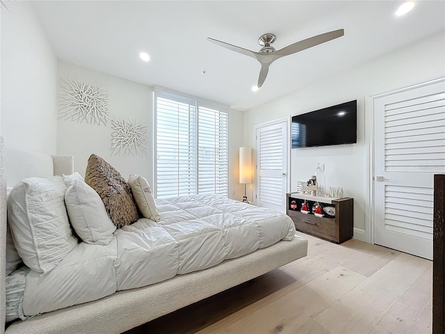 bedroom with ceiling fan and light wood-type flooring